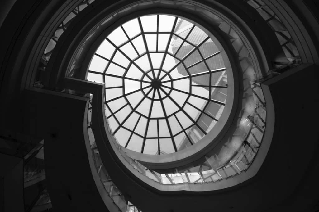 low-angle photo of clear glass ceiling